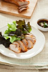 cut pork chop and vegetable in plate