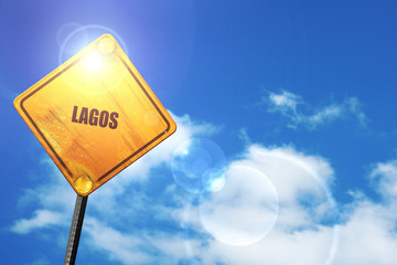 Yellow road sign with a blue sky and white clouds: lagos