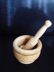 Morter with a garlics on black background