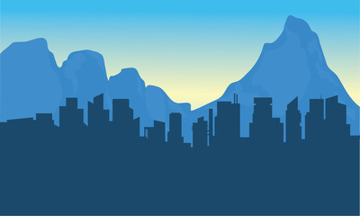 Silhouettte of city and background mountain