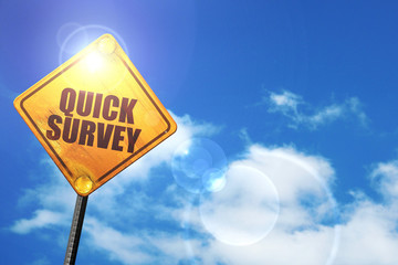 Yellow road sign with a blue sky and white clouds: quick survey