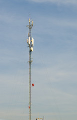 Obraz premium Communications tower with on blue sky.