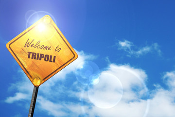 Yellow road sign with a blue sky and white clouds: Welcome to tr