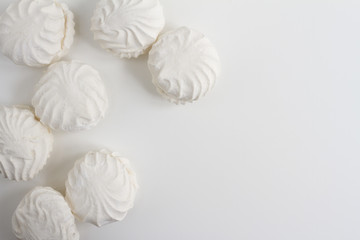 Fototapeta na wymiar Top view of Latvian marshmallovs - zefiri on white background with copy space