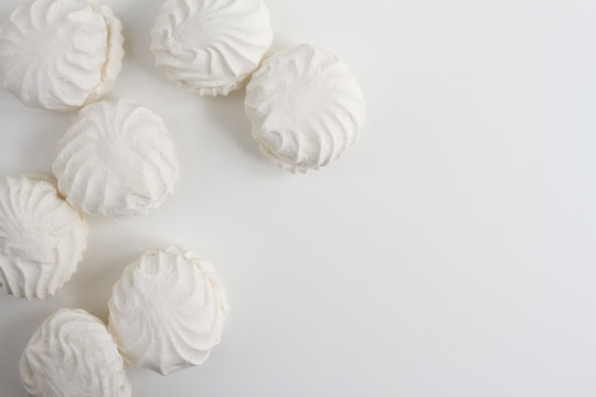 Top view of Latvian marshmallovs - zefiri on white background with copy space