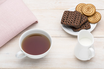Cup of tea and various cookies