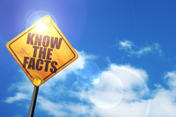 Yellow road sign with a blue sky and white clouds: know the fact