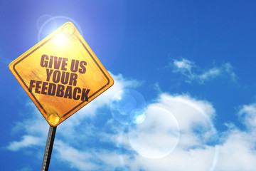 Yellow road sign with a blue sky and white clouds: give us your 