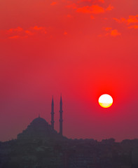 Sunset and Yavuz Selim mosque, Istanbul, Turkey