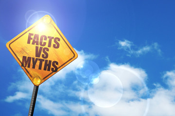Yellow road sign with a blue sky and white clouds: facts vs myth
