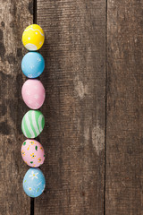 Vintage colorful easter eggs on wood table background