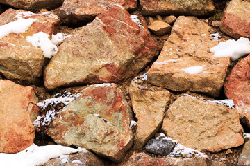 Fragment of a wall from a chipped stone in Alps mountains