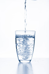 water splashing from glass isolated on white background