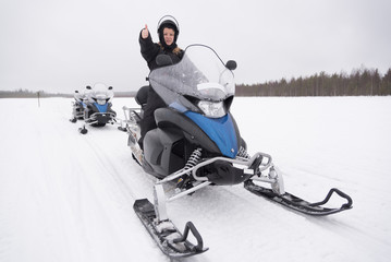 Woman on a snowmobile