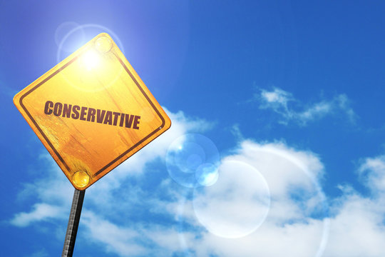 Yellow road sign with a blue sky and white clouds: conservative