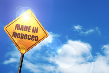 Yellow road sign with a blue sky and white clouds: Made in moroc