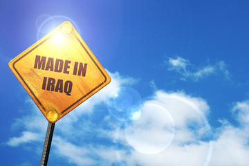 Naklejka premium Yellow road sign with a blue sky and white clouds: Made in iraq