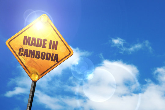 Yellow road sign with a blue sky and white clouds: Made in cambo