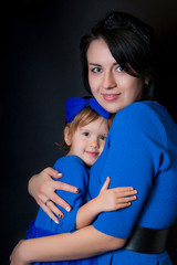 Happy daughter hugging her mother. people, happiness, love, family