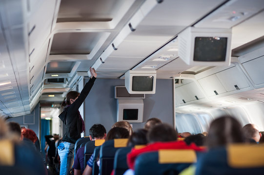 Fototapeta Interior inside of the plane with passengers.