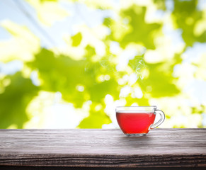 Cup of tea on wooden board