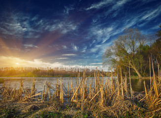 Sunset over the lake in the village