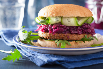 veggie soy burger with pickled red cabbage cucumber arugula