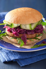 veggie soy burger with pickled red cabbage cucumber arugula