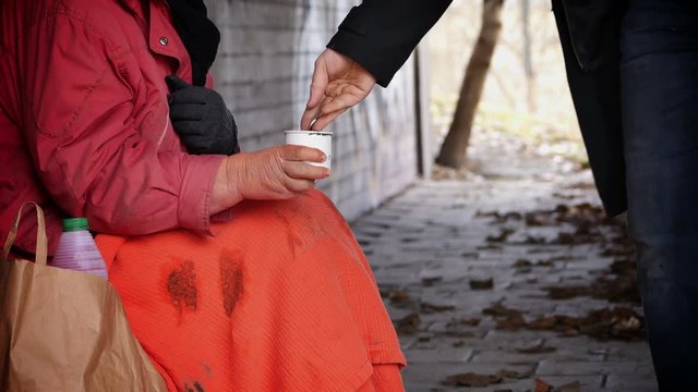 Women asks for charity - homeless 