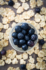 Yogurt with fresh blueberries and cereals
