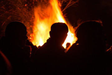 Fototapeta na wymiar People in front of a fire