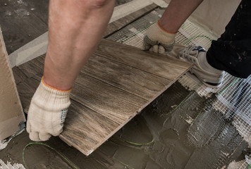 Laying tile stylized tree on the insulated floor.
