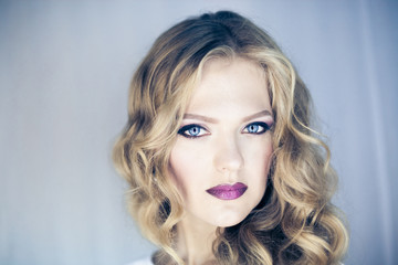Fototapeta premium Portrait of beautiful young blond woman with clean face .Close up beauty portrait of young model with clean fresh skin and professional makeup.