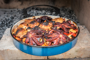 Preparing and Cooking of octopus and chicken in traditional Balk