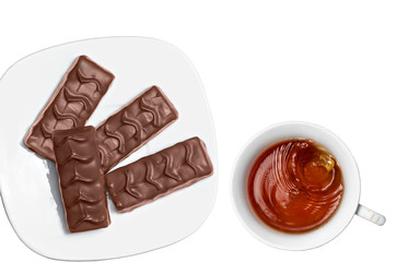 Tea and chocolate on a white background