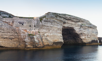 Fototapeta na wymiar Bay of Bonifacio, rocks with grotto. Corsica
