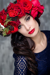 Beautiful woman with roses bunch