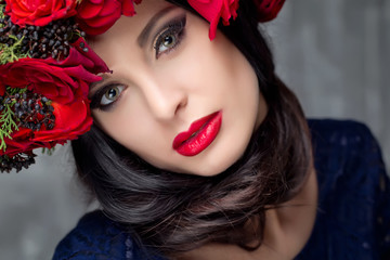 Beautiful woman with roses bunch