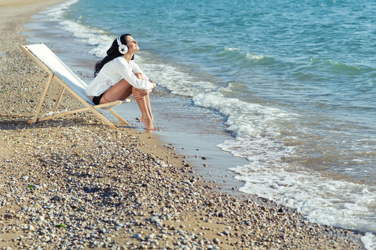 Woman Are Listening Music On The Beach 