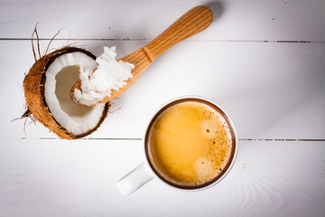 Bulletproof coffee, it's a coffee blended with butter or coconut oil. Wiev from above on coffee and coconut. Part of ketogenic diet, better choice before trainning.