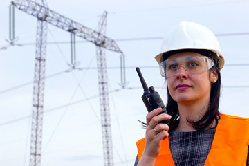 Electrical distribution engineer talking  on a walkie- talkie