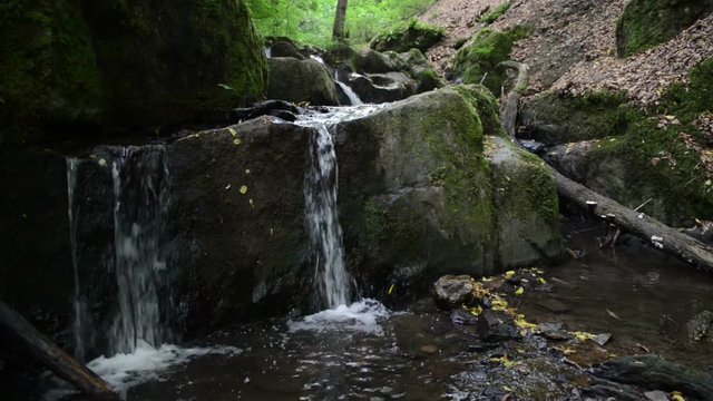 wild stream Brodenbach next to Mosel River. Waterfalls and stones. wild landscape. (Germany, Rhineland-palatinate) 
