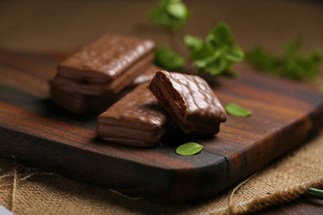 Chocolate wafer cookies on brown wood