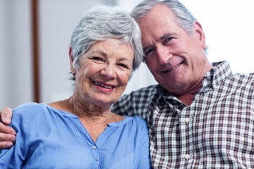 Portrait of senior couple embracing each other