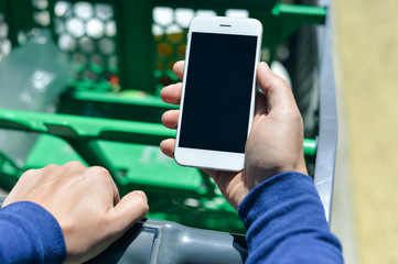 Closeup on person holding mobile smartphone in hand during shopping
