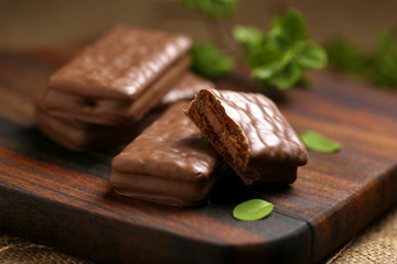 Chocolate wafer cookies on brown wood