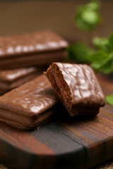 Chocolate wafer cookies on brown wood