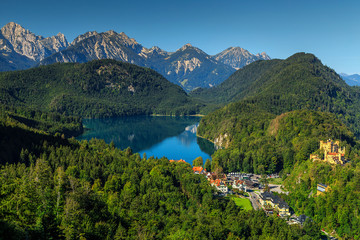 Famous spectacular Hohenschwangau castle and high mountains in background,Germany