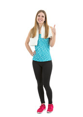 Happy beautiful fitness woman showing thumbs up