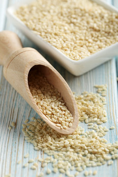 Sesame seeds on a blue wooden table